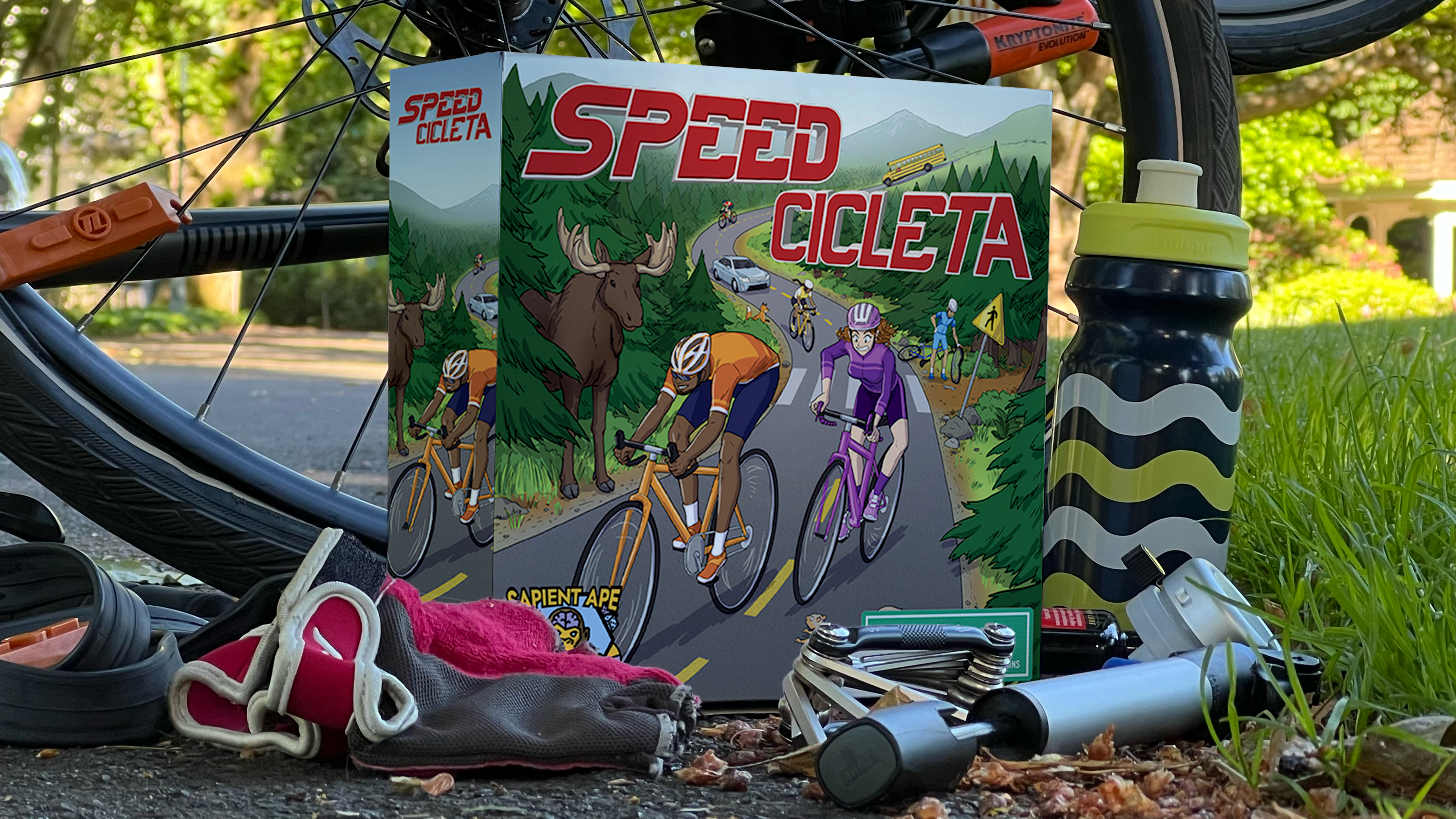 Photograph of the Speedcicleta game box surrounded by bicycling paraphernalia